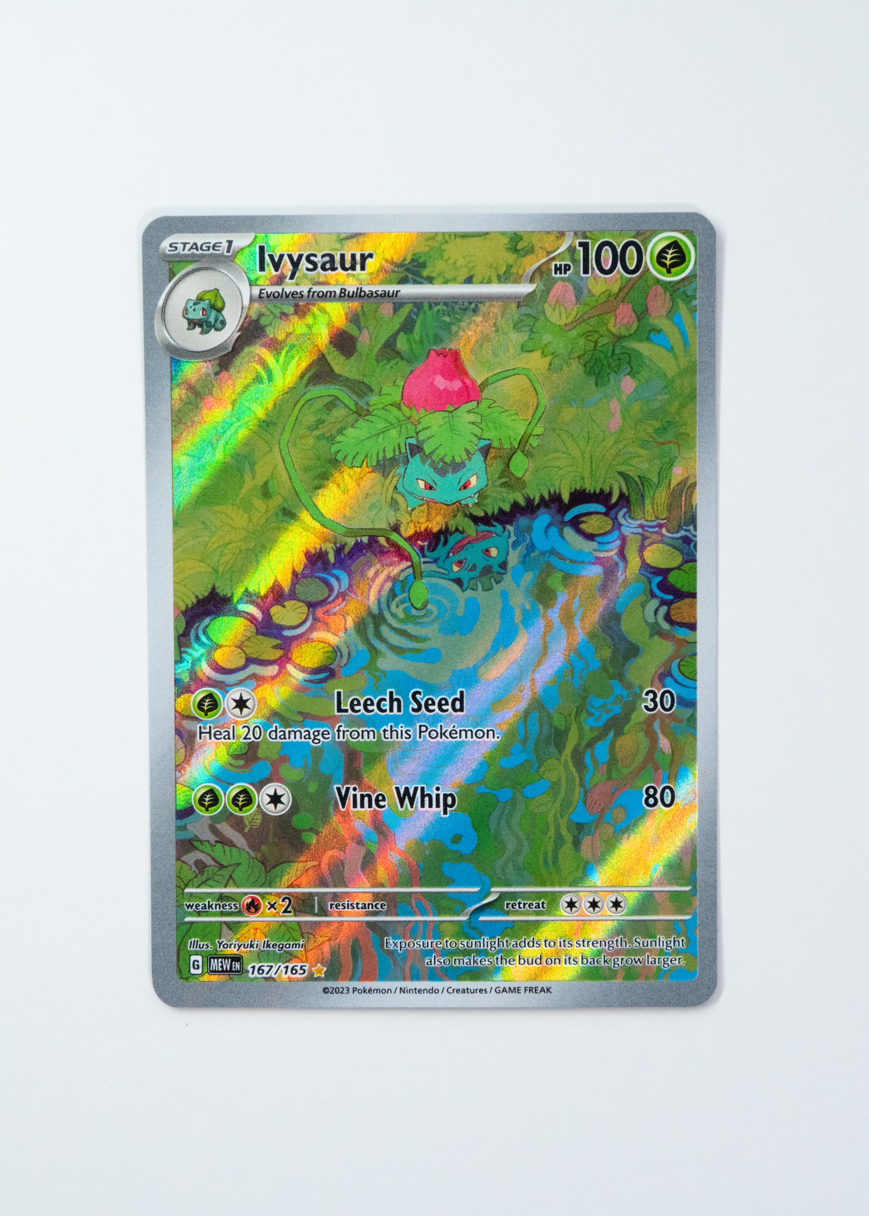 Pokémon trading card featuring Ivysaur with a colorful design on a white background