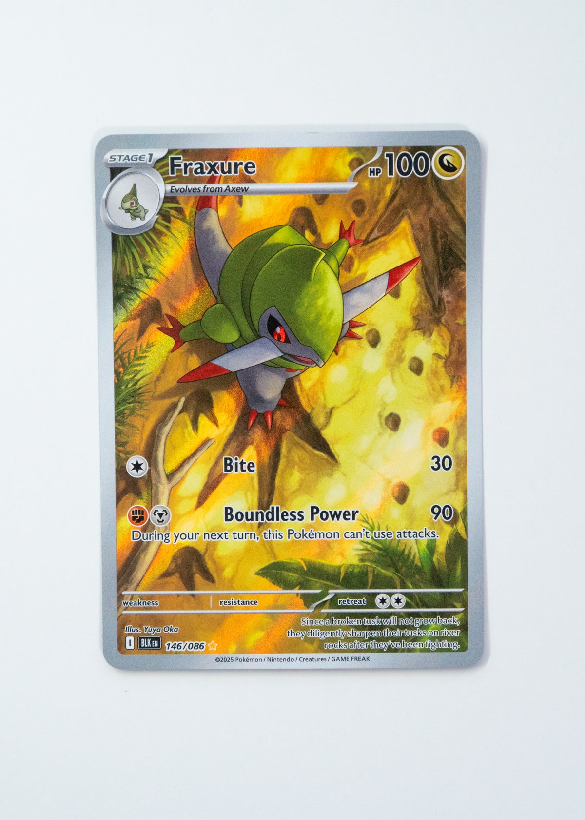 Pokémon trading card featuring Fraxure on a white background