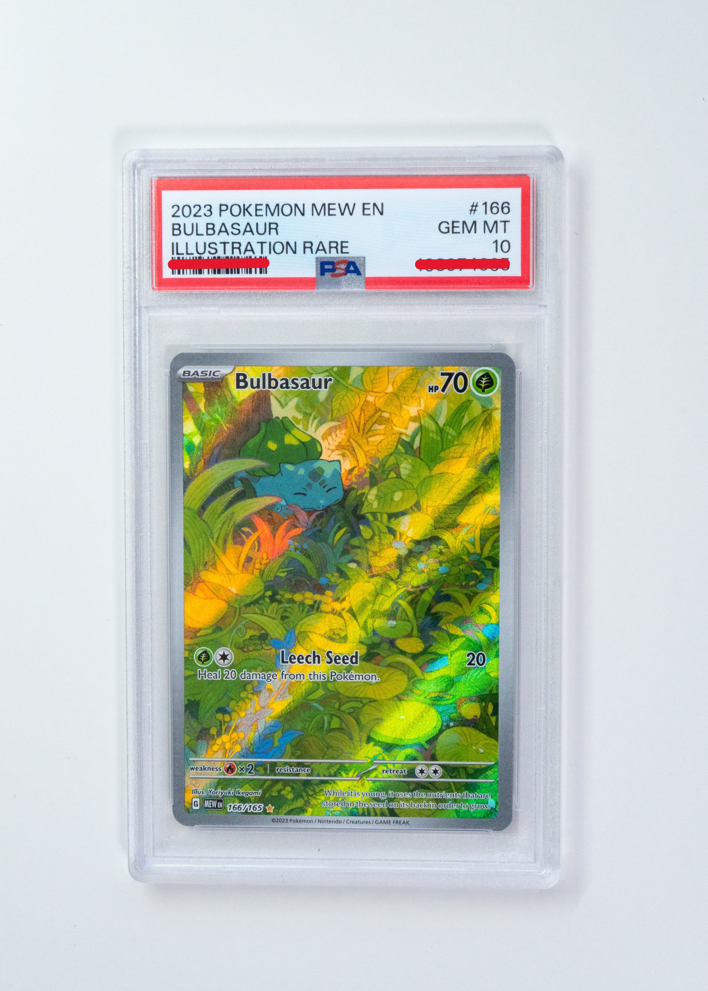 Pokémon trading card featuring Bulbasaur in a clear protective case on a white background